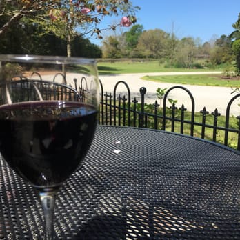 La Belle Amie Vineyard - A glass of Silvered Tongued Devil overlooking the beautiful vineyards! - Wine Tasting Room Near Me - Little River, South Carolina La Belle Amie Vineyard - A glass of Silvered Tongued Devil overlooking the beautiful vineyards! - Wine Tasting Room Near Me - Little River, South Carolina