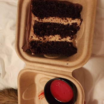 Colington Cafe - Chocolate cake with raspberry sauce (to go) - American Near Me - Kill Devil Hills, North Carolina