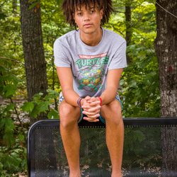 Bob Leverone Photography - headshot of young man sitting on a bench outside on-locfation