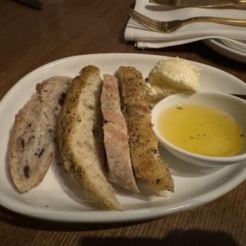 Mangiamo - Complimentary rosemary bread, butter and olive oil - Italian Near Me - Grand Rapids, Michigan Mangiamo - Complimentary rosemary bread, butter and olive oil - Italian Near Me - Grand Rapids, Michigan