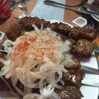 Cafe Kashkar - Lamb, Lamb Rib, and Ground Meat Skewers. The onions might seem excessive but they are light and a bit sweet. - Turkish Near Me - Brooklyn, New York