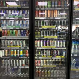 a refrigerated beverage display in a grocery store
