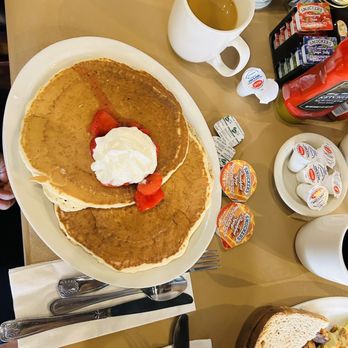 Craylee's - Stack of two pancakes with fresh strawberries and cream. - Breakfast & Brunch Near Me - Utica, New York