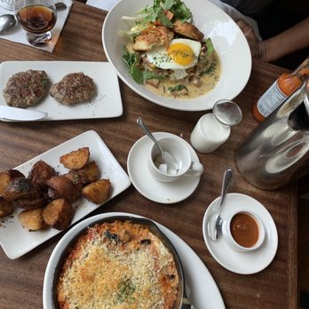 Tilikum Place Cafe - Egg Baked eggs, Roasted Potatoes, Biscuits and Mushroom Gravy, House Made Pork Breakfast Sausage - New American Near Me - Seattle, Washington