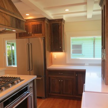 Mark Porch Construction - a kitchen with a sink and stove - General Contractors Near Me