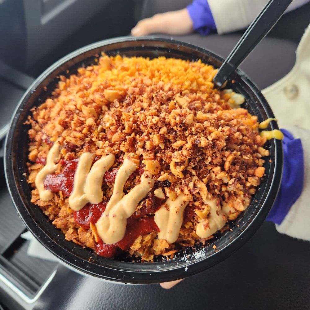 Eloteria - a person holding a bowl of food - Food Trucks Near Me - McAllen, Texas