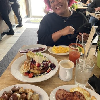 Green Eggs Cafe - Me and our spread. Creme brulee French toast, roasted potatoes, Turkey sausage, over medium eggs, scrambled eggs. Bloody Mary, latte. - Breakfast & Brunch Near Me - Philadelphia, Pennsylvania