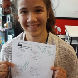 Mathnasium - Student-of-the-Month, Maddie C., shows off her most recent math test.