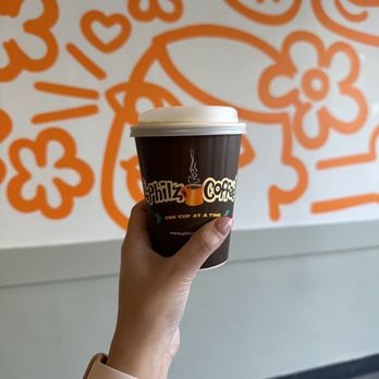 Philz Coffee - a hand holding a cup of coffee - Coffee & Tea Near Me - Glendale, California