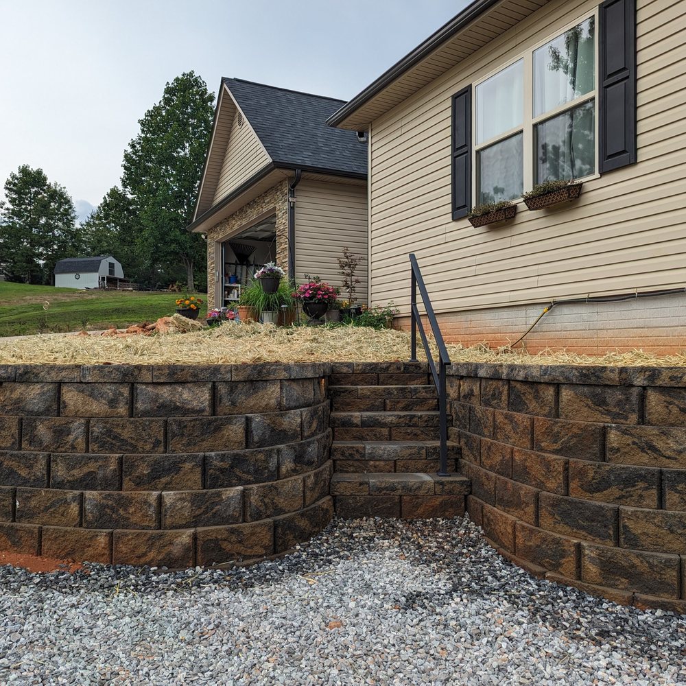 Rooted Landscape Management - a retaining wall and steps - Landscaping Near Me Rooted Landscape Management - a retaining wall and steps - Landscaping Near Me