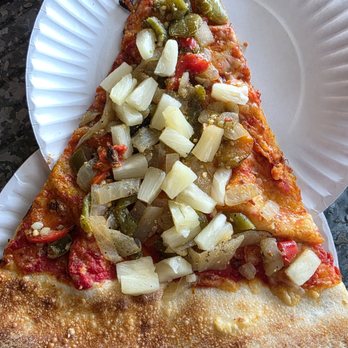 Benny Adelinas - Close-up of a Slice of Versace pizza with pineapple. - Pizza Near Me - Hardy, Virginia