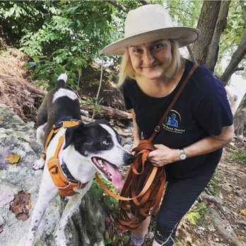 Well Done Charlie Dog Training & Behavior - Trainer Toni hiking with her dog Menchie at Turkey Run. - Pet Training Near Me Well Done Charlie Dog Training & Behavior - Trainer Toni hiking with her dog Menchie at Turkey Run. - Pet Training Near Me