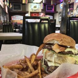 Collins Tavern - This is the Tavern Burger. Add fries and a beer for under $10! Yup, that's right! Btw, that's Gene in the background.