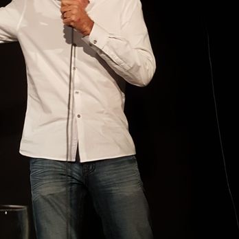 J.R.'s Comedy Club - a man holding a microphone - Comedy Clubs Near Me - Valencia, California J.R.'s Comedy Club - a man holding a microphone - Comedy Clubs Near Me - Valencia, California