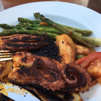 La Lunita - Octopus with an excellent smoky spicy sauce, and a side of asparagus. Recommended. - Mexican Near Me - Akumal, ROO La Lunita - Octopus with an excellent smoky spicy sauce, and a side of asparagus. Recommended. - Mexican Near Me - Akumal, ROO