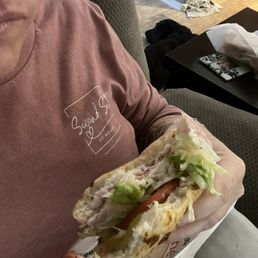 Enjoying my delicious sandwich with jalapeño bread!!