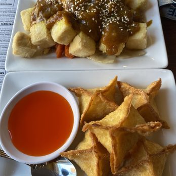 Thai at Indiana - a plate of food and a bowl of sauce - Thai Near Me - Indiana, Pennsylvania Thai at Indiana - a plate of food and a bowl of sauce - Thai Near Me - Indiana, Pennsylvania