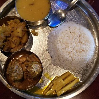 Asian Garden - Nepali Thali, contains rice, chicken curry, chole, lentil curry and radish pickle. - Indian Near Me - Ocean City, Maryland Asian Garden - Nepali Thali, contains rice, chicken curry, chole, lentil curry and radish pickle. - Indian Near Me - Ocean City, Maryland