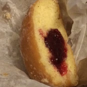 Primo's Donuts - Donut with raspberry filling cross-section. - Donuts Near Me - Los Angeles, California Primo's Donuts - Donut with raspberry filling cross-section. - Donuts Near Me - Los Angeles, California