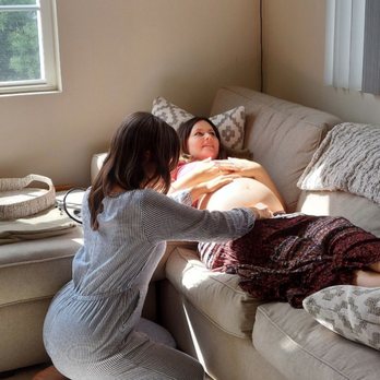 Midwives Bay Area - Shannon checking baby's position - Lactation Services Near Me Midwives Bay Area - Shannon checking baby's position - Lactation Services Near Me