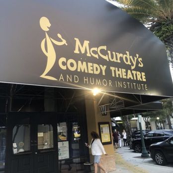 McCurdy's Comedy Theatre - a woman walking out of the entrance - Comedy Clubs Near Me - Sarasota, Florida McCurdy's Comedy Theatre - a woman walking out of the entrance - Comedy Clubs Near Me - Sarasota, Florida
