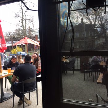Fourth Street Taproom & Kitchen - View of the front porch from inside - Bars Near Me - Columbus, Ohio