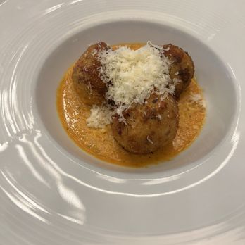 Il Piatto - Arancini Fried risotto balls stuffed with mozzarella, mushrooms, and truffle oil; served with a tomato cream sauce $13.95 - Italian Near Me - Washington, DC, District of Columbia