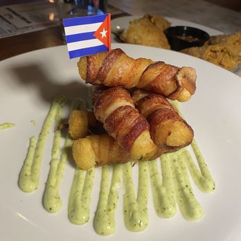 Mambo Cuban Restaurant & Lounge Harrison - Yuca wrapped in bacon (appetizer) - Cuban Near Me - Harrison, New Jersey Mambo Cuban Restaurant & Lounge Harrison - Yuca wrapped in bacon (appetizer) - Cuban Near Me - Harrison, New Jersey