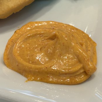 Mi Espana - Braves sauce- secret ingredient to kick up the flavor a notch - Spanish Near Me - Princeton, New Jersey