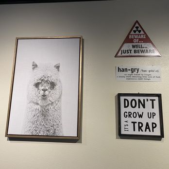 Manny's Place - Framed llama print, vintage-style warning sign, "hangry" definition sign, and framed print that says "Don't grow up. It's a trap" - Burgers Near Me - Tacoma, Washington Manny's Place - Framed llama print, vintage-style warning sign, "hangry" definition sign, and framed print that says "Don't grow up. It's a trap" - Burgers Near Me - Tacoma, Washington