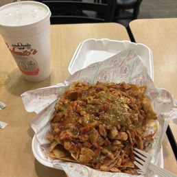 Pollo asada nachos with a large drink