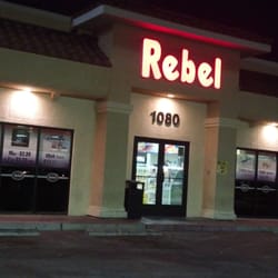 Rebel Stores - Rebel petro (gas) station building (at night).