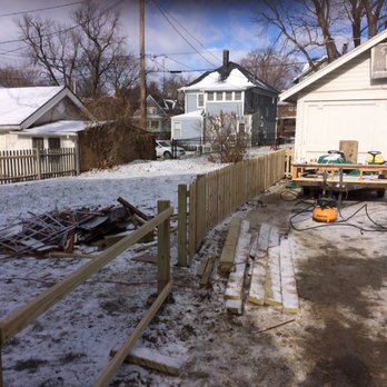 Full 9 Yards - a snow covered yard with a fence - Lawn Services Near Me