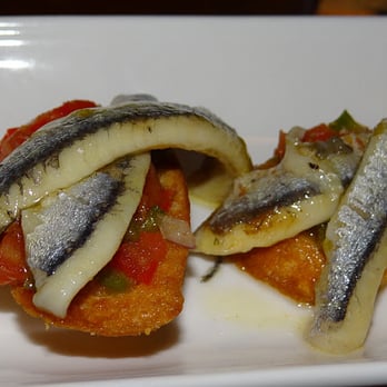 Rincon Escondido Tapas - Close-up of boquerones (sardines) - Spanish Near Me - Miami, Florida Rincon Escondido Tapas - Close-up of boquerones (sardines) - Spanish Near Me - Miami, Florida