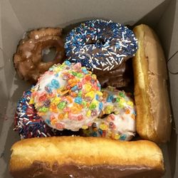 8 donuts for $20 (surcharge for specialty donuts like the chocolate/maple logs and old fashioned donuts).