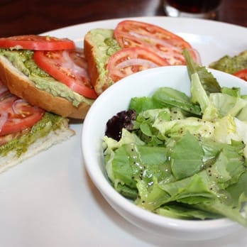 The Slanted Porch - Monet- open faced avocado, housemade pesto, lemon, tomato, & onion, I had it on their homemade sourdough w/ side salad - American Near Me - Fallon, Nevada The Slanted Porch - Monet- open faced avocado, housemade pesto, lemon, tomato, & onion, I had it on their homemade sourdough w/ side salad - American Near Me - Fallon, Nevada