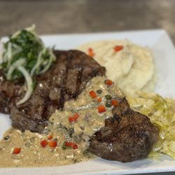 Namaka Restaurant N Bar - 16 ounce ribeye with black pepper bourbon gravy served with the side of garlic mashed potatoes