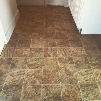 Sully's Carpets - a kitchen floor with a brown tile - Flooring Near Me - Haverhill, Massachusetts