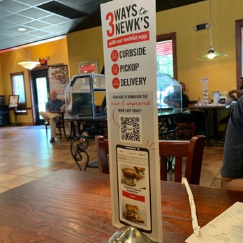 Newk's Eatery - a menu on the counter - Pizza Near Me - Memphis, Tennessee