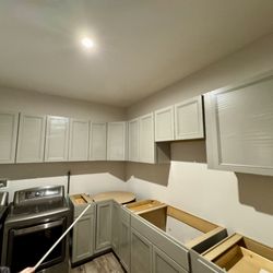TIM Workers - Install cabinets in laundry rooms