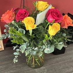 This is what I got. Thrown together roses with a bunch of foliage. I think the people who sell flowers in the corner do better than this.