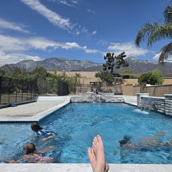 FM Pool Construction - Pool from the pool lounge chairs, Baja step on the left. - Pool & Hot Tub Service Near Me