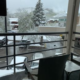 All rooms have a balcony with chairs and table and view out sliding glass doors