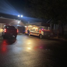 a taco truck parked in a parking lot a taco truck parked in a parking lot
