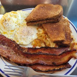 Perfect eggs over medium hanh browns. Toast and thick peppery