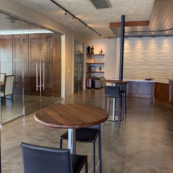 The Wine Thief - a large room with a table and chairs - Wine Tasting Room Near Me - Napa, California The Wine Thief - a large room with a table and chairs - Wine Tasting Room Near Me - Napa, California