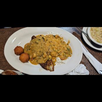 Philay's Catfish N' More - IG: tonylameats | IVY'S SPECIAL Fish filet topped with crawfish étouffée over rice. - Seafood Near Me - Gonzales, Louisiana