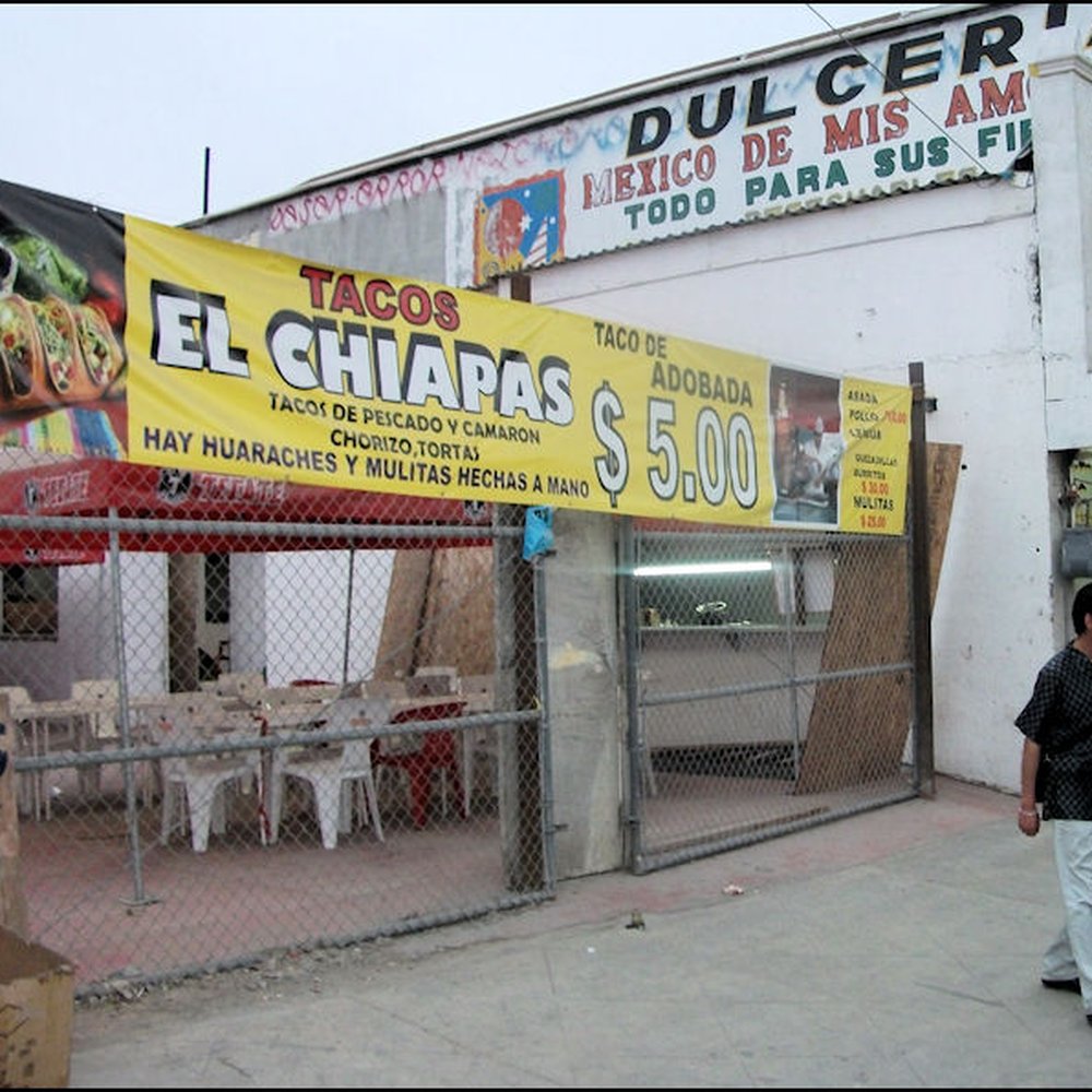 Tacos El Chiapas - Tacos El Chiapas is located in the white building, with the brightly lit fluorescent light, and it's open to the street. - Mexican Near Me - Tijuana, BCN