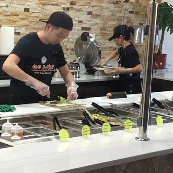 Ono Poke - Making my sushiritto's .. I ordered two, but one is more than enough !!! - Salad Near Me - Hurst, Texas