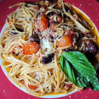 Piccola Italia - a plate of spaghetti with tomatoes and olives - Italian Near Me - Mauldin, South Carolina Piccola Italia - a plate of spaghetti with tomatoes and olives - Italian Near Me - Mauldin, South Carolina